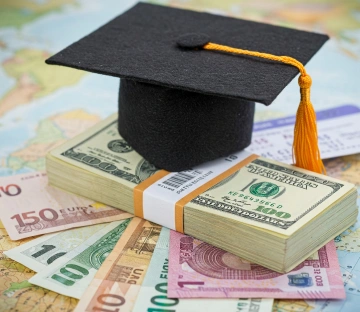 Stack of books with mortarboard