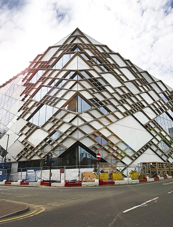 Stack of books with mortarboard