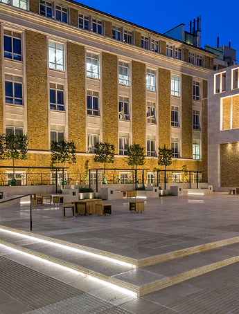 Stack of books with mortarboard
