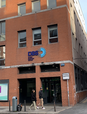 Stack of books with mortarboard