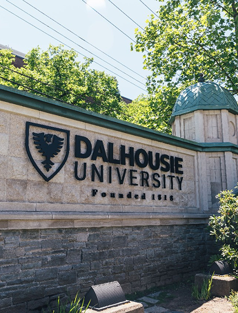 Stack of books with mortarboard