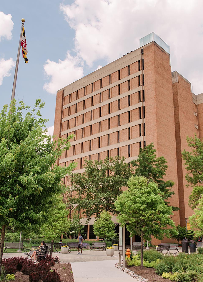 Stack of books with mortarboard
