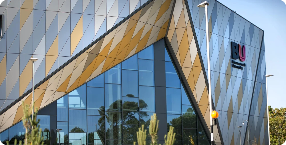 Stack of books with mortarboard