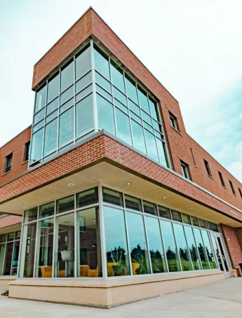Stack of books with mortarboard