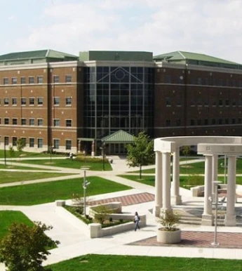 Stack of books with mortarboard