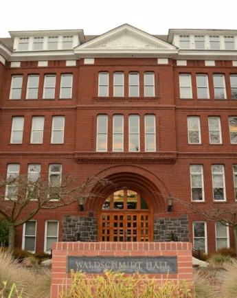 Stack of books with mortarboard