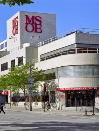 Stack of books with mortarboard