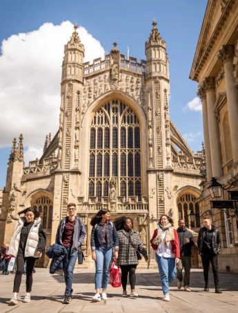 Stack of books with mortarboard