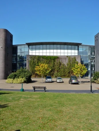 Stack of books with mortarboard