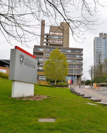 Stack of books with mortarboard
