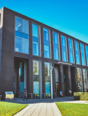 Stack of books with mortarboard