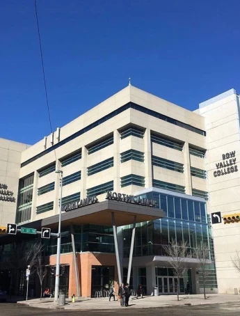 Stack of books with mortarboard